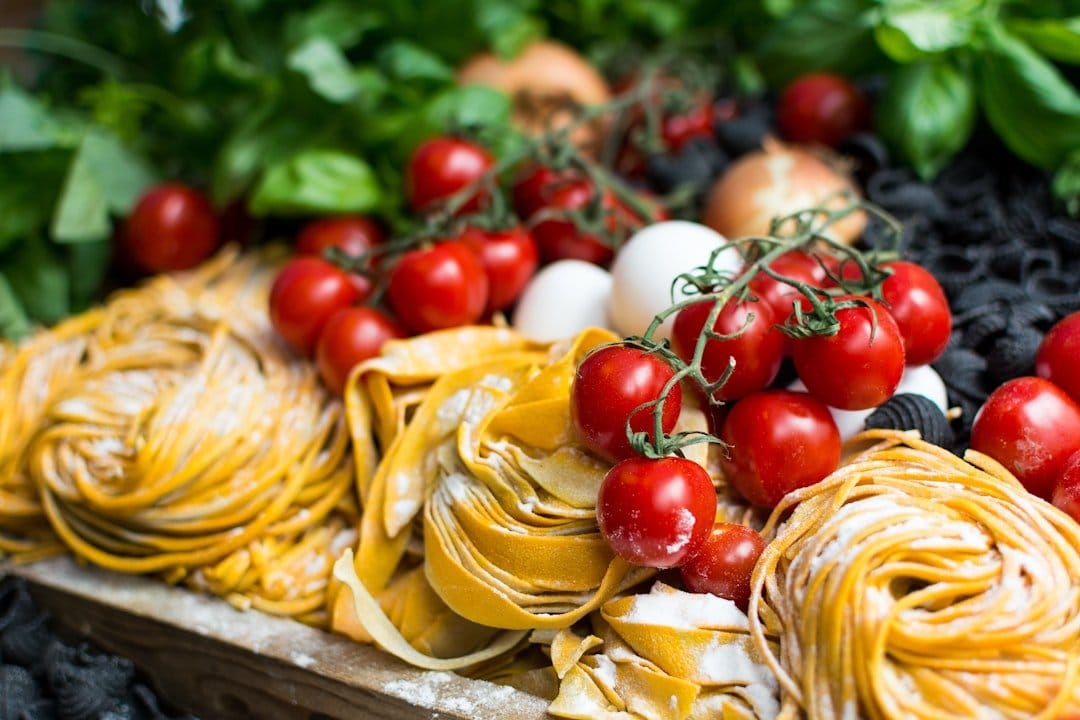 A vibrant spread of seasonal Italian ingredients, including fresh vegetables, herbs, and pasta, showcasing the essence of seasonal cooking.