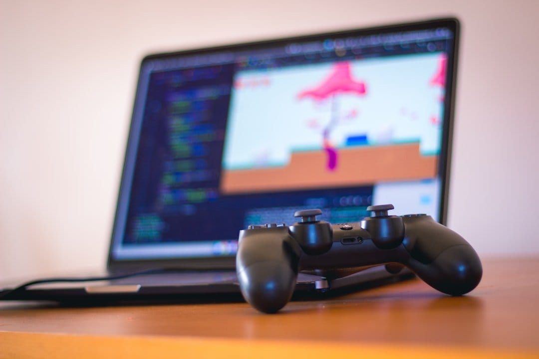 A computer screen displaying code and game graphics, illustrating AI game development process.