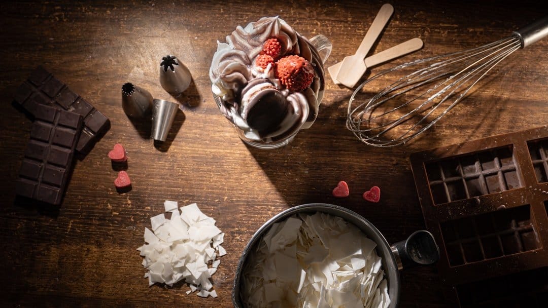 Colorful gelato scoops in various flavors displayed in a gelateria, highlighting the art of Italian gelato making.