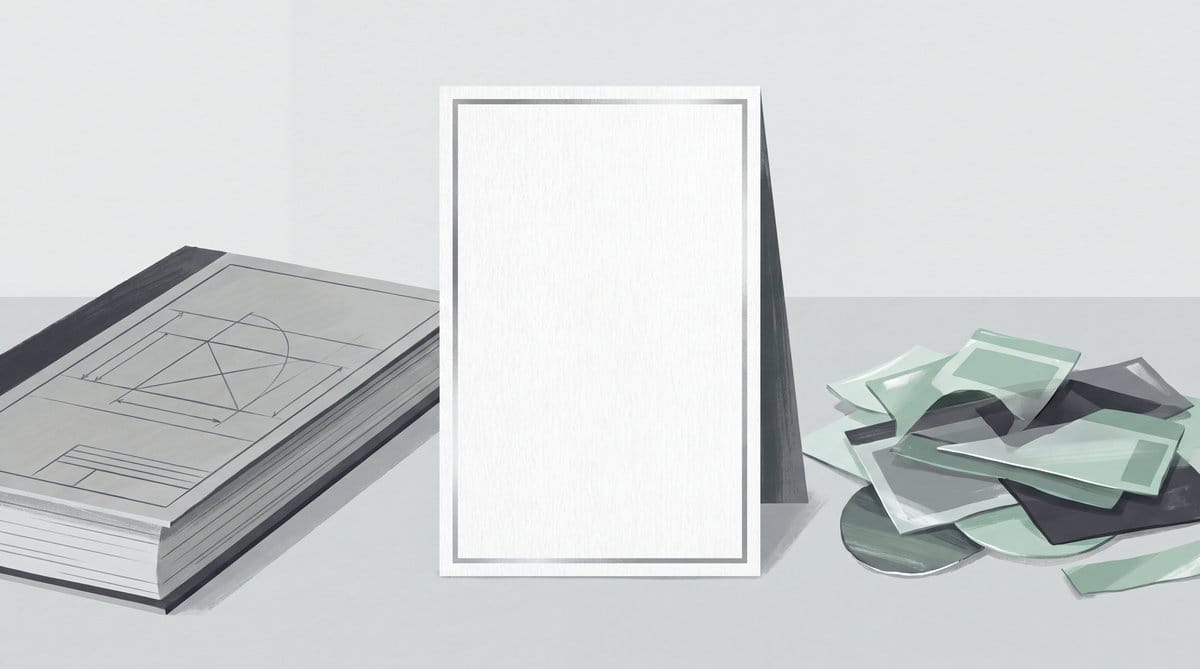 Blank upright citation card flanked by a technical document stack and scattered green and charcoal clippings.