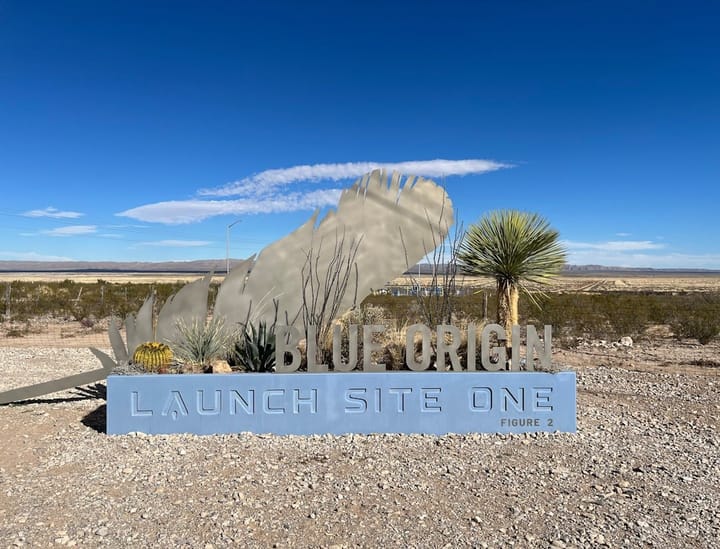 A rocket launch at Blue Origin's facility, showcasing powerful engines and smoke, impacting NASA's lunar mission plans.