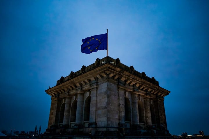 European Union officials celebrate the AI Omnibus deal, highlighting a balance between regulation and innovation in technology.