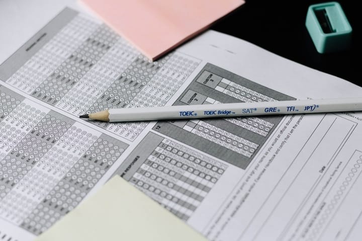 A person solving a math problem on paper, surrounded by equations, highlighting human creativity in mathematics versus AI.
