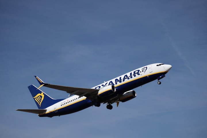 Ryanair flight interior showing family seating arrangement, highlighting consumer rights and seating fees controversy.