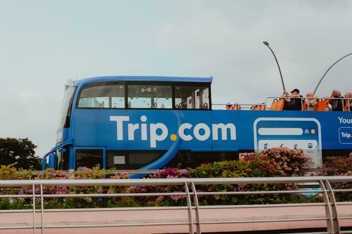 A bustling hotel lobby with guests checking in, highlighting the impact of Trip.com's fine on the travel industry.