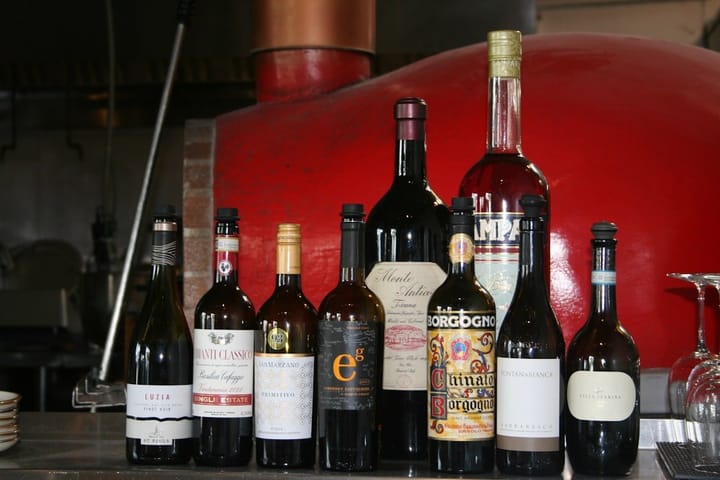 A bottle of Chianti Classico Gran Selezione with a glass, showcasing its rich color and elegant label.