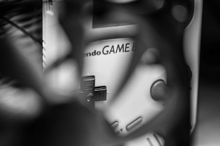 A computer screen displaying an AI game development interface with code and graphics, illustrating tech innovation.