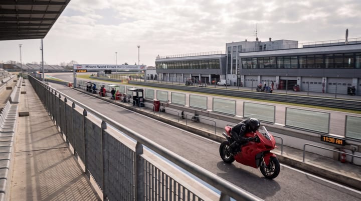 Ducati 850cc prototype accelerates from Misano pit exit during private MotoGP test, opening clear gap over Yamaha.